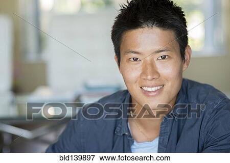 Stock Photo - Korean man smiling. Fotosearch