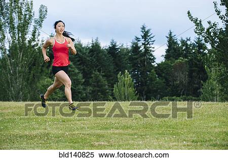 Korean woman running in field View Large Photo Image Stock Photography - Korean woman running in field. Fotosearch