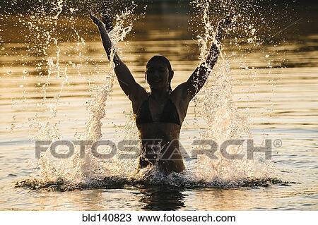 Korean woman splashing in lake View Large Photo Image Stock Image - Korean woman splashing in lake. Fotosearch