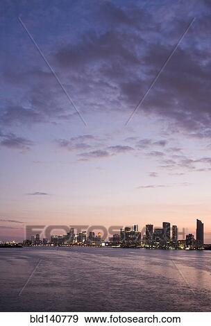 Stock Photo - Miami city skyline and harbor at sunset, Florida, United States. Fotosearch