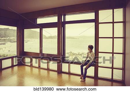 Mixed race boy looking out window View Large Photo Image Stock Image - Mixed race boy looking out window. Fotosearch