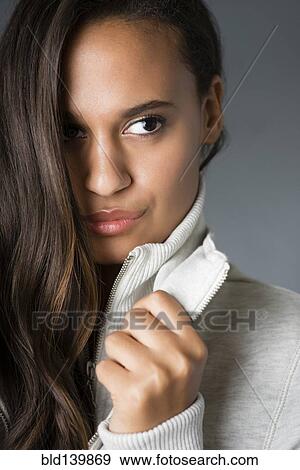 Stock Photo - Mixed race woman holding collar. Fotosearch