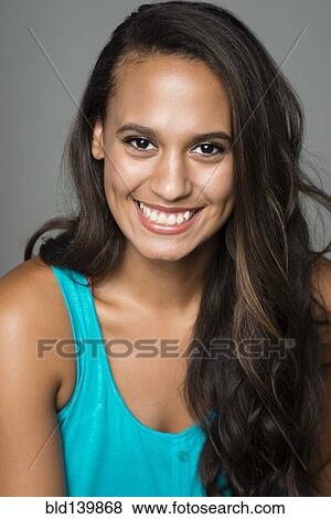 Stock Photo - Mixed race woman smiling. Fotosearch