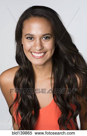 Mixed race woman smiling View Large Photo Image Stock Photography - Mixed race woman smiling. Fotosearch