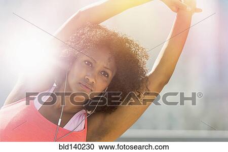 Mixed race woman stretching arms View Large Photo Image Stock Image - Mixed race woman stretching arms. Fotosearch