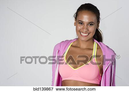Stock Photo - Mixed race woman wearing sportswear. Fotosearch