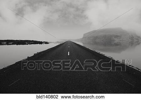 Paved road over still water View Large Photo Image Stock Image - Paved road over still water. Fotosearch