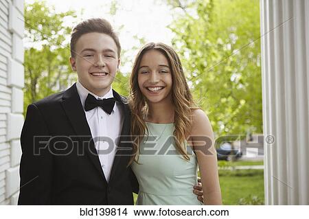 Picture - Smiling teenage couple dressed up for prom. Fotosearch