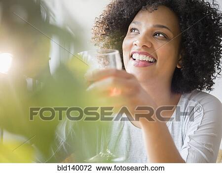 Smiling woman drinking glass of wine View Large Photo Image Stock Image - Smiling woman drinking glass of wine. Fotosearch