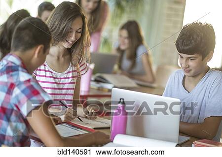 Students studying in school cafeteria View Large Photo Image Stock Image - Students studying in school cafeteria. Fotosearch