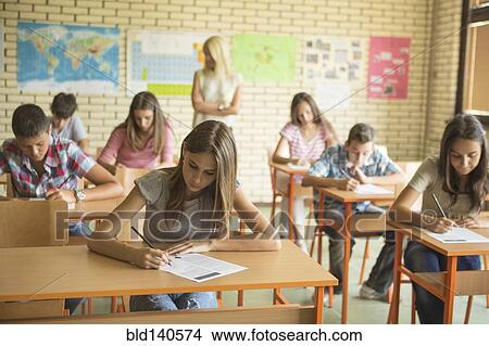 Students taking test in classroom View Large Photo Image Picture - Students taking test in classroom. Fotosearch