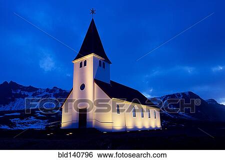 White church illuminated near snowy mountains at night View Large Photo Image Stock Photograph - White church illuminated near snowy mountains at night. Fotosearch