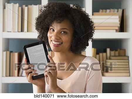 Woman holding digital tablet with e View Large Photo Image Stock Image - Woman holding digital tablet with e. Fotosearch