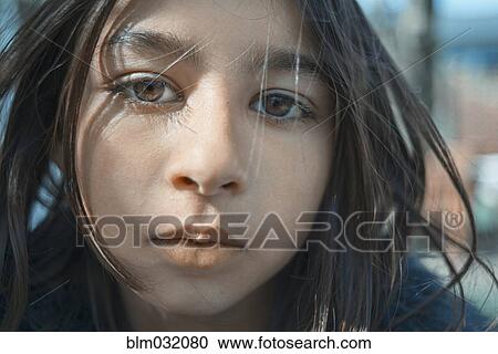 Stock Image - Close up of face of mixed race girl. Fotosearch