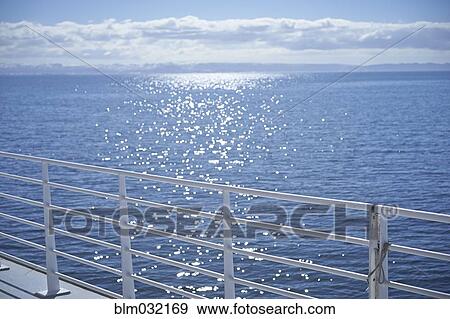 Stock Photo - White railing overlooking seascape. Fotosearch