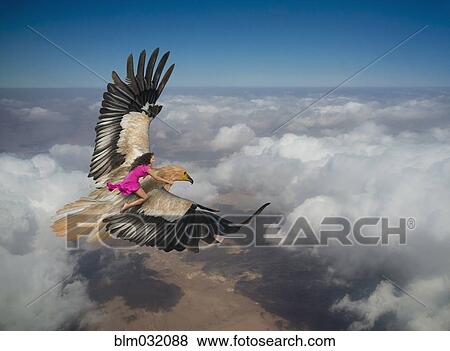 Woman riding eagle flying over clouds in sky View Large Photo Image Stock Photo - Woman riding eagle flying over clouds in sky. Fotosearch