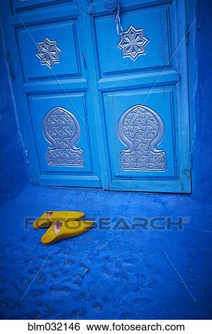 Yellow shoes near ornate blue doorway View Large Photo Image Stock Photograph - Yellow shoes near ornate blue doorway. Fotosearch