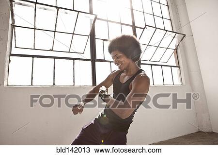 African American man dancing in loft View Large Photo Image Stock Image - African American man dancing in loft. Fotosearch