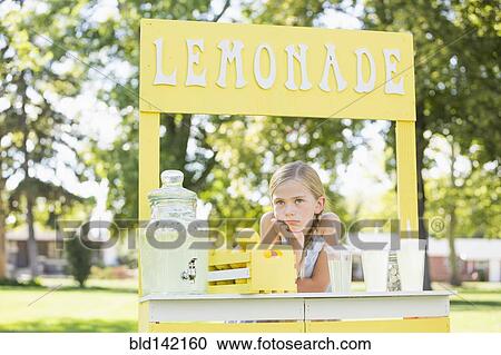 Stock Image - Bored Caucasian girl at lemonade stand. Fotosearch