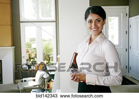 Businesswoman smiling at home View Large Photo Image Stock Image - Businesswoman smiling at home. Fotosearch