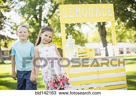 Caucasian brother and sister smiling at lemonade stand View Large Photo Image Stock Image - Caucasian brother and sister smiling at lemonade stand. Fotosearch