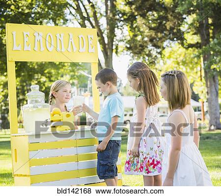 Stock Photo - Caucasian children buying drinks at lemonade stand. Fotosearch