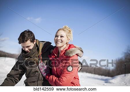 Stock Photo - Caucasian couple in winter. Fotosearch