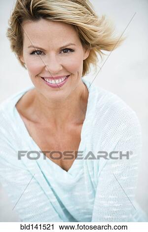 Stock Image - Caucasian woman smiling. Fotosearch