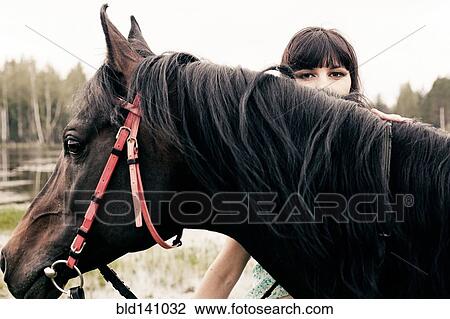 Caucasian woman with horse outdoors View Large Photo Image Stock Image - Caucasian woman with horse outdoors. Fotosearch