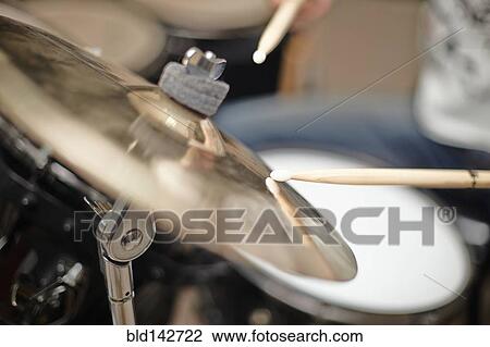 Close up of drumsticks hitting cymbals View Large Photo Image Stock Image - Close up of drumsticks hitting cymbals. Fotosearch