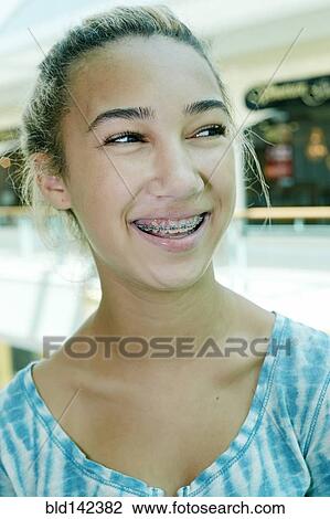 Close up of mixed race teenage girl smiling View Large Photo Image Stock Image - Close up of mixed race teenage girl smiling. Fotosearch