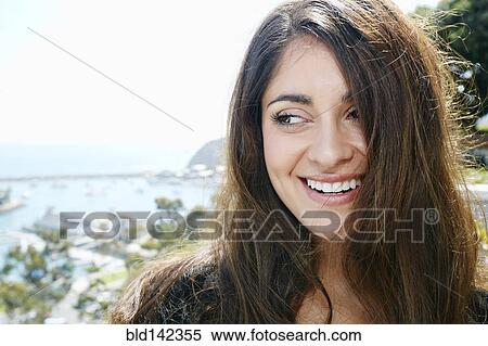 Stock Photography - Close up of mixed race woman smiling. Fotosearch