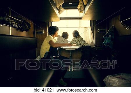 Father and children looking out trailer window View Large Photo Image Stock Image - Father and children looking out trailer window . Fotosearch