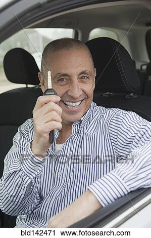 Hispanic senior man holding new car key View Large Photo Image Stock Image - Hispanic senior man holding new car key. Fotosearch