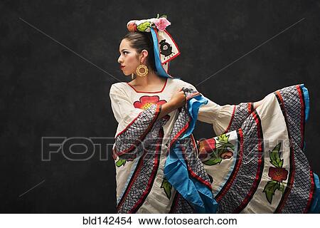 Hispanic teenage girl dancing in Sinaloa Folkloric dress View Large Photo Image Picture - Hispanic teenage girl dancing in Sinaloa Folkloric dress. Fotosearch