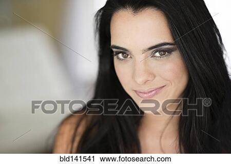 Stock Image - Hispanic woman smiling. Fotosearch