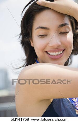 Stock Photo - Hispanic woman smiling. Fotosearch