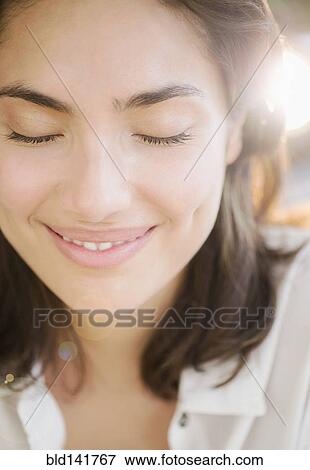 Stock Photo - Hispanic woman smiling. Fotosearch