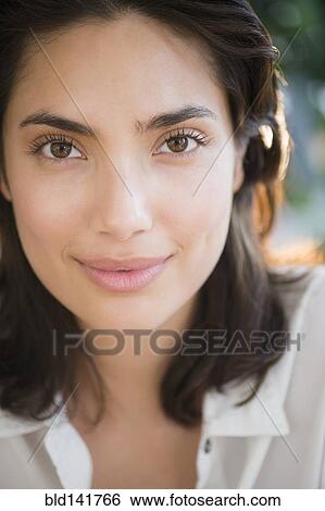 Stock Photograph - Hispanic woman smiling. Fotosearch