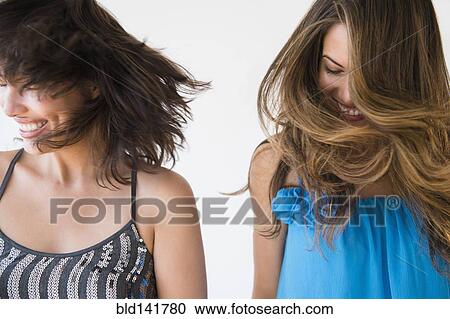 Hispanic women shaking their hair View Large Photo Image Stock Image - Hispanic women shaking their hair . Fotosearch