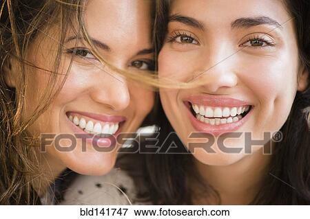 Stock Photo - Hispanic women smiling. Fotosearch