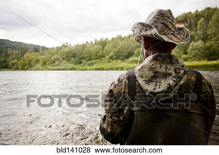 Mari man fishing in river View Large Photo Image Stock Photo - Mari man fishing in river. Fotosearch