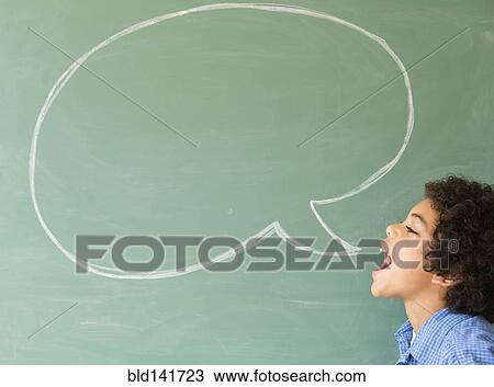 Stock Image - Mixed race boy shouting into speech bubble on chalkboard. Fotosearch