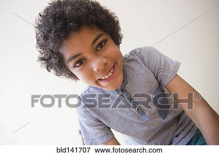 Stock Photo - Mixed race boy smiling. Fotosearch