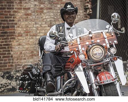 Senior African American man riding motorcycle View Large Photo Image Picture - Senior African American man riding motorcycle. Fotosearch