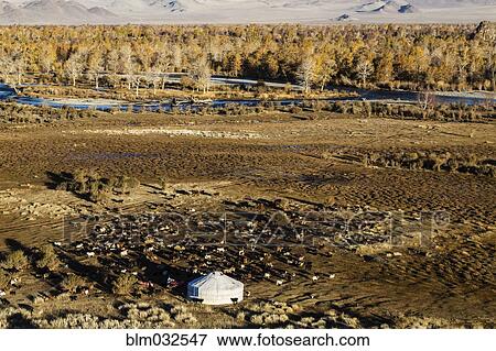 Stock Photo - Aerial view of nomadic campsite in rocky remote landscape. Fotosearch