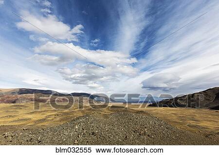 Blue sky over rocky remote landscape View Large Photo Image Stock Photography - Blue sky over rocky remote landscape. Fotosearch