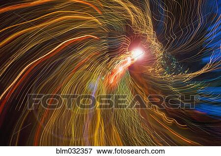 Blurred view of flowing light trails View Large Photo Image Stock Photo - Blurred view of flowing light trails. Fotosearch