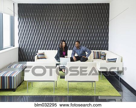 Business people talking in office lobby View Large Photo Image Stock Photography - Business people talking in office lobby. Fotosearch