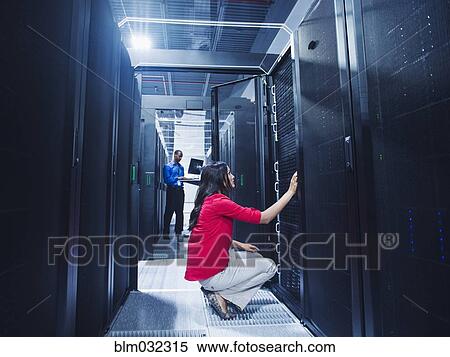 Business people working in server room View Large Photo Image Stock Photography - Business people working in server room. Fotosearch